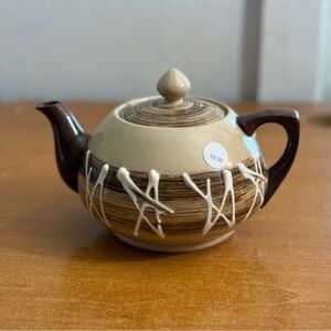 Antique brown and white ceramic teapot‎
